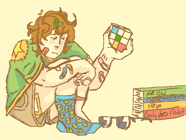 Depressed dude holding a Rubik’s cube in a pile of